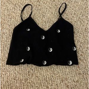 black tank top with yin and yang design